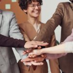 photo of people holding each other s hands